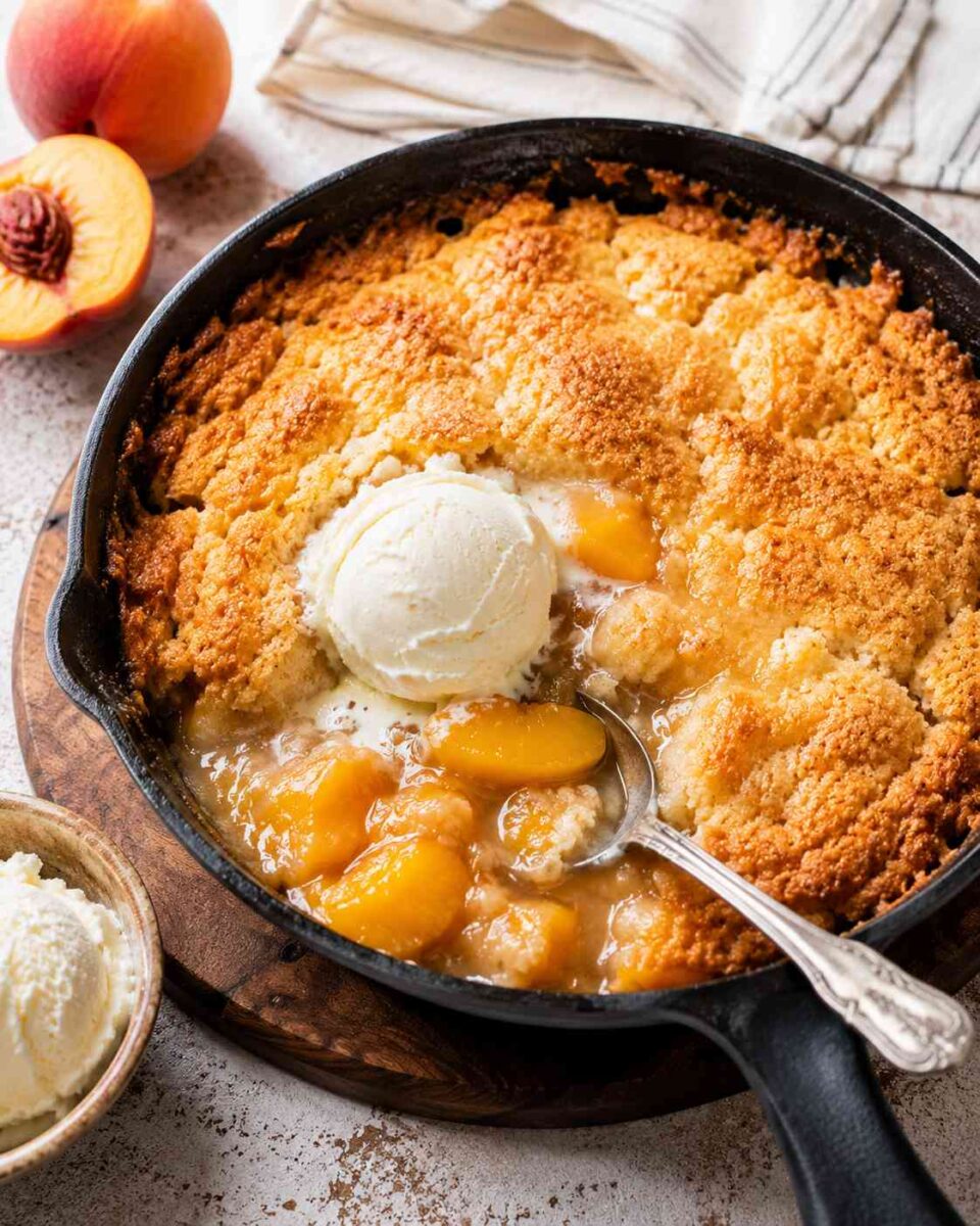 Grandma’s Peach Cobbler Dump Cake (Easy Southern Dessert Recipe) 2 Peach cobbler dump cake with vanilla ice cream