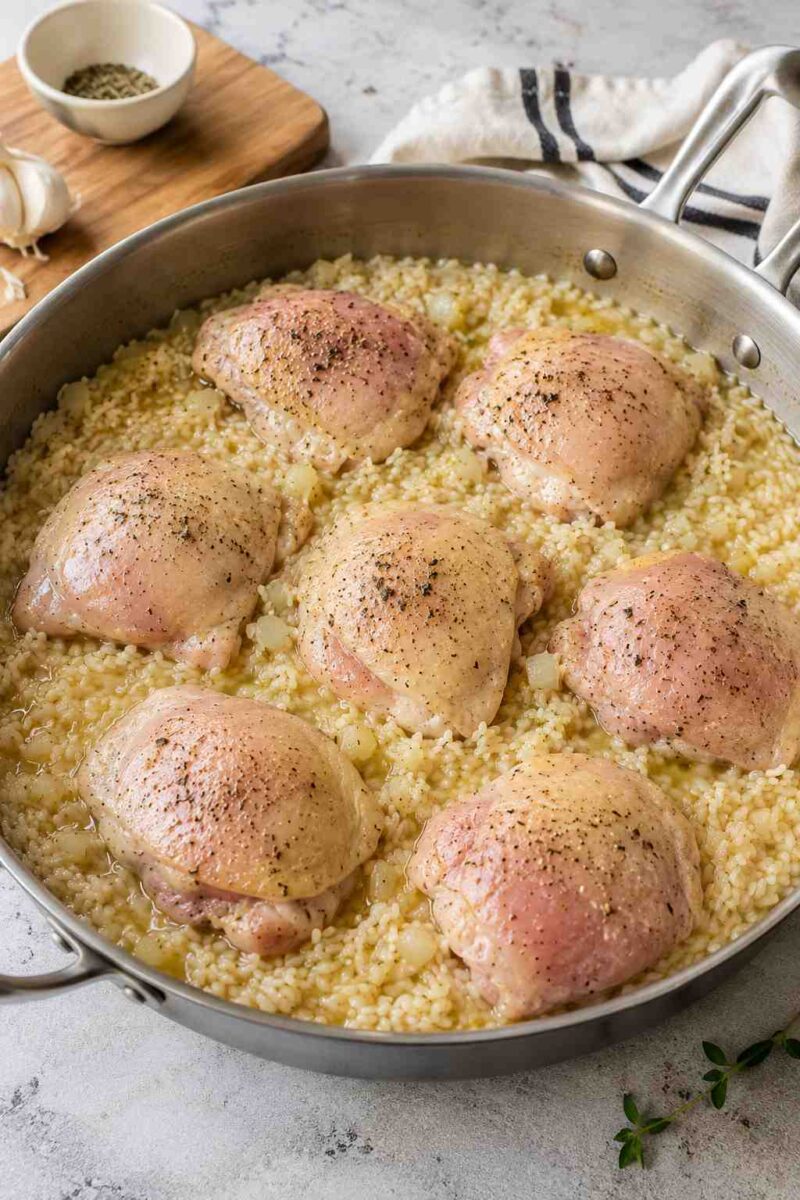 Seared chicken thighs on seasoned rice